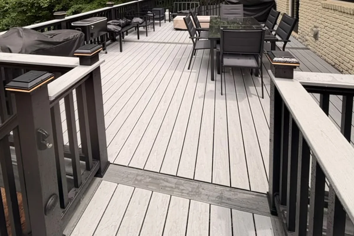Light gray composite decking with dark railings